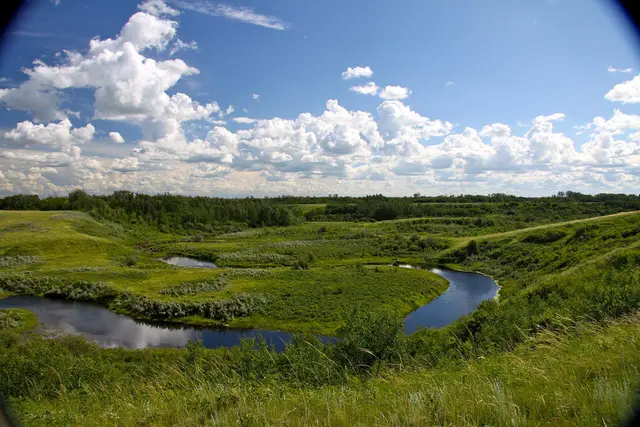 Winding creek in the valley under a big sky