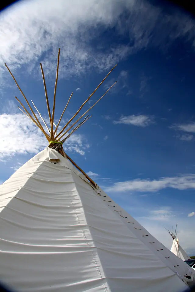 White tipi against a blue sky